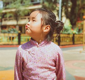 A child looking up with curiosity
