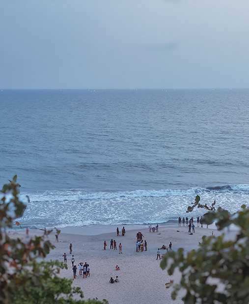 People along a beach seen from above