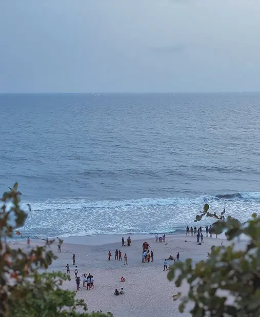 People along a beach seen from above