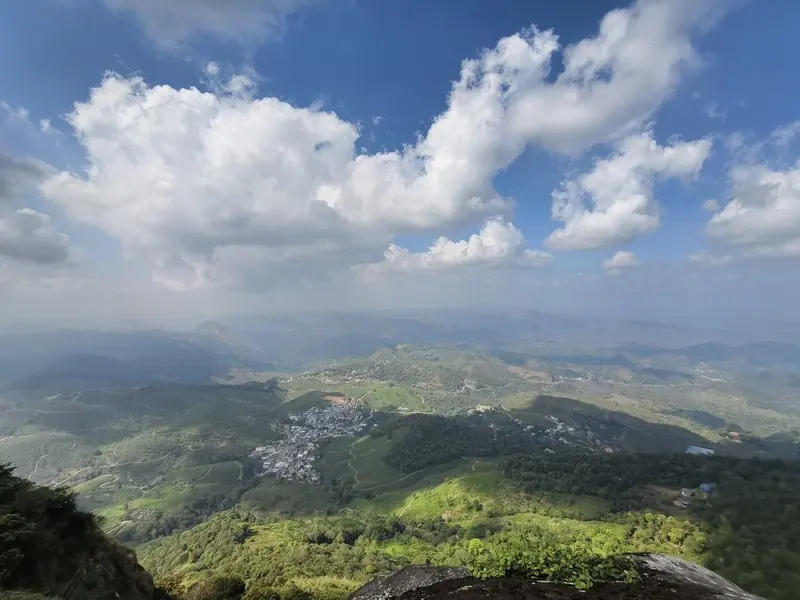 Sunlight and cloud shadows crossing a wide mountain landscape