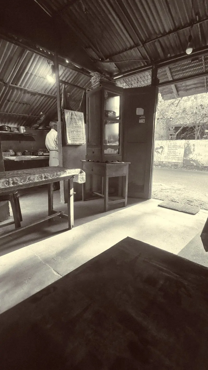 Sunlight entering a quiet interior through an open doorway